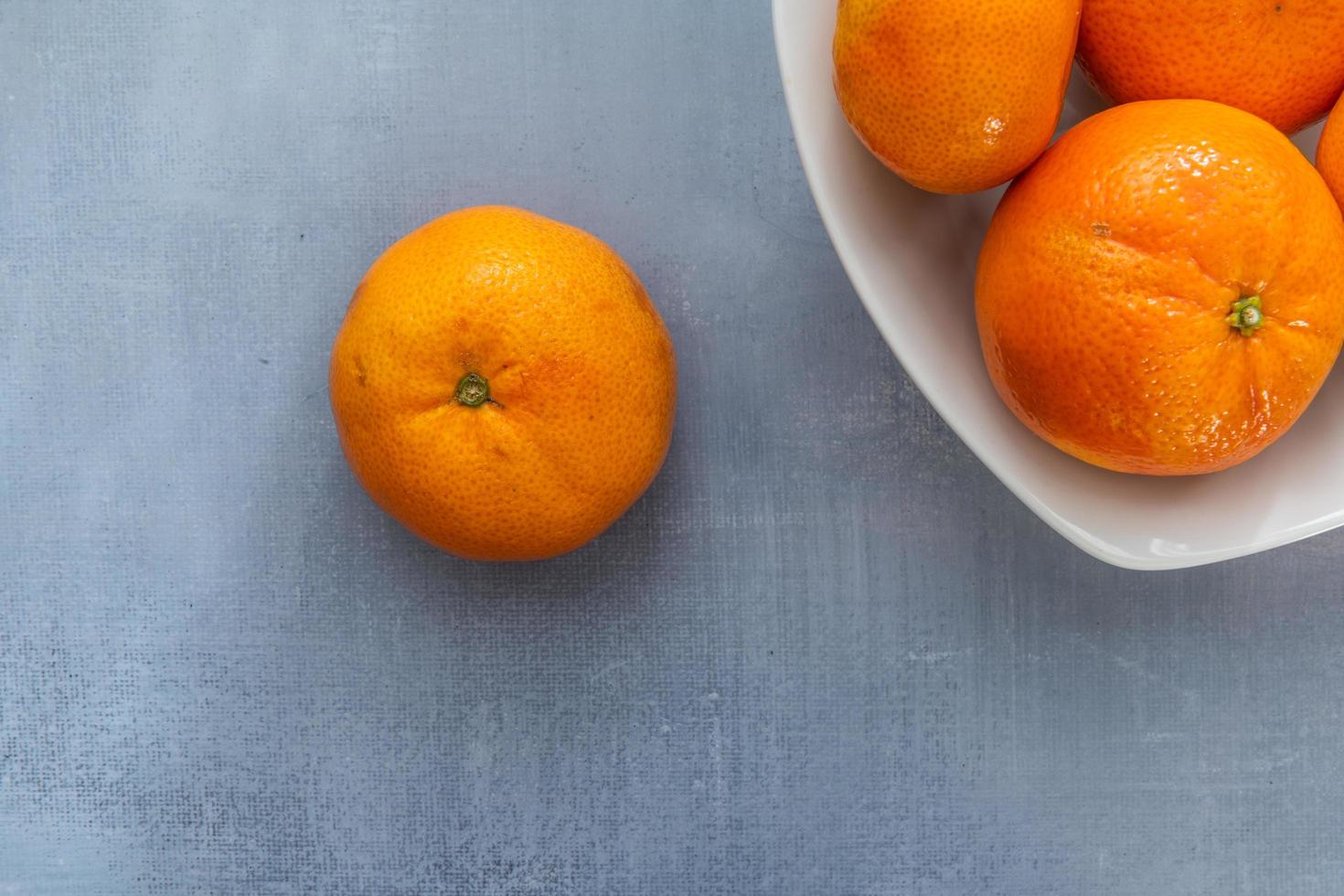 Delicious clementines on rustic background photo