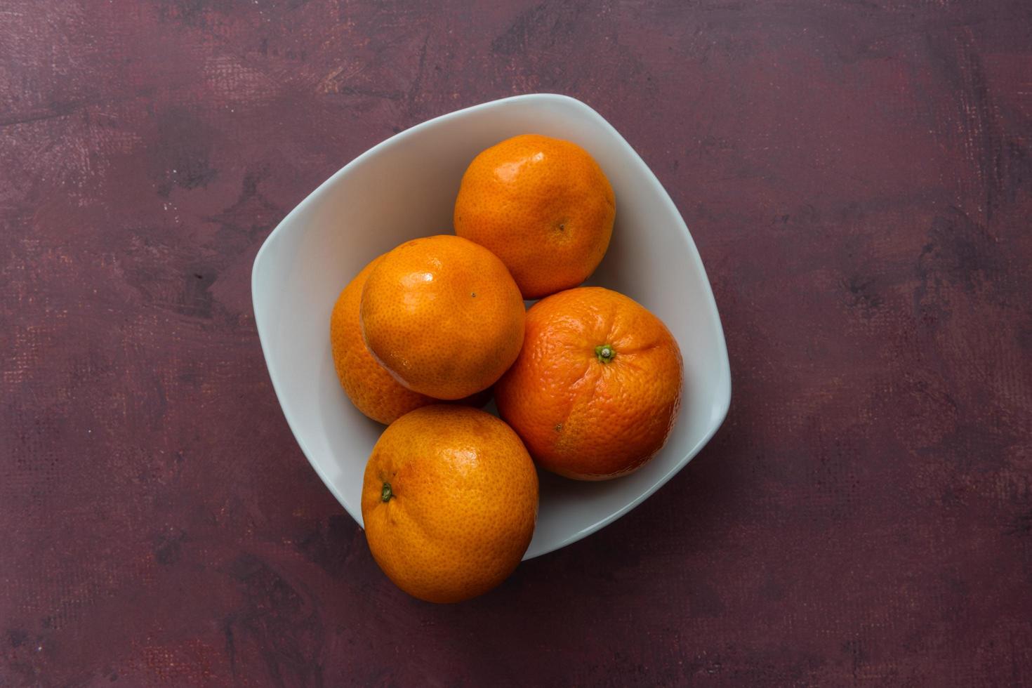 Delicious clementines on rustic background photo