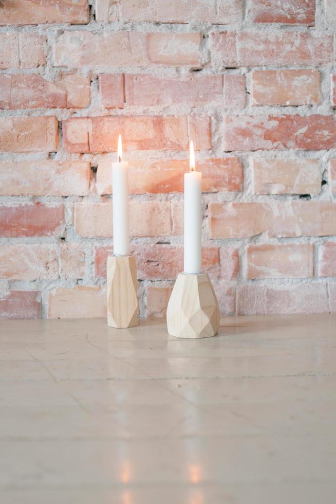 Two candlelights on table photo