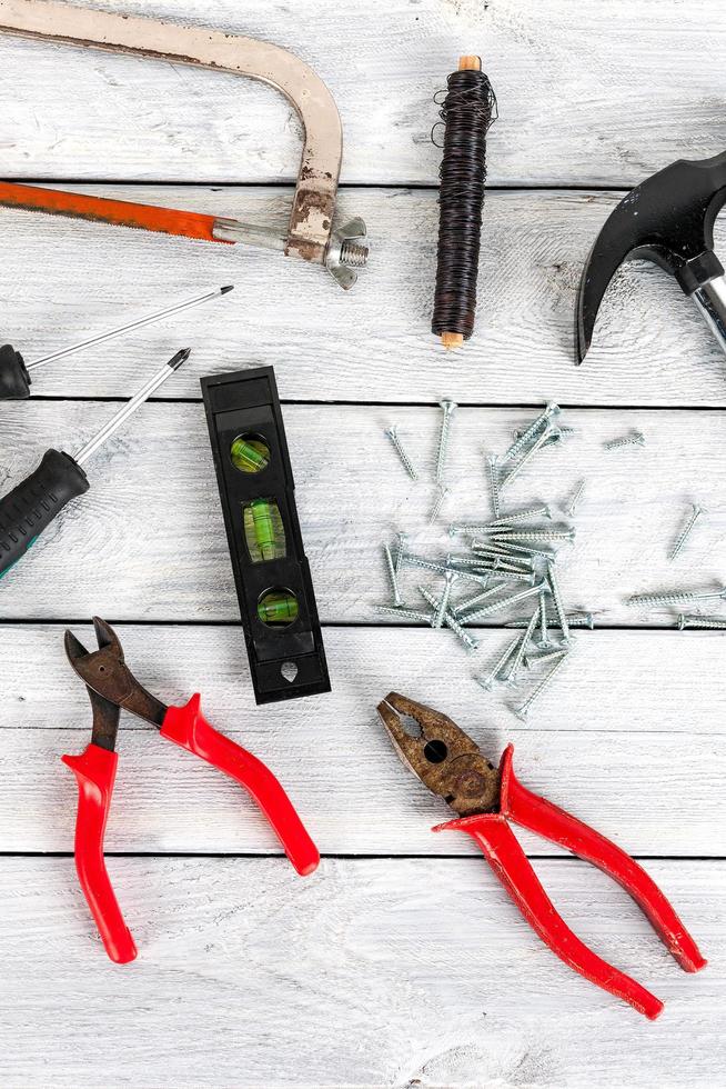 Tools on a wooden background photo