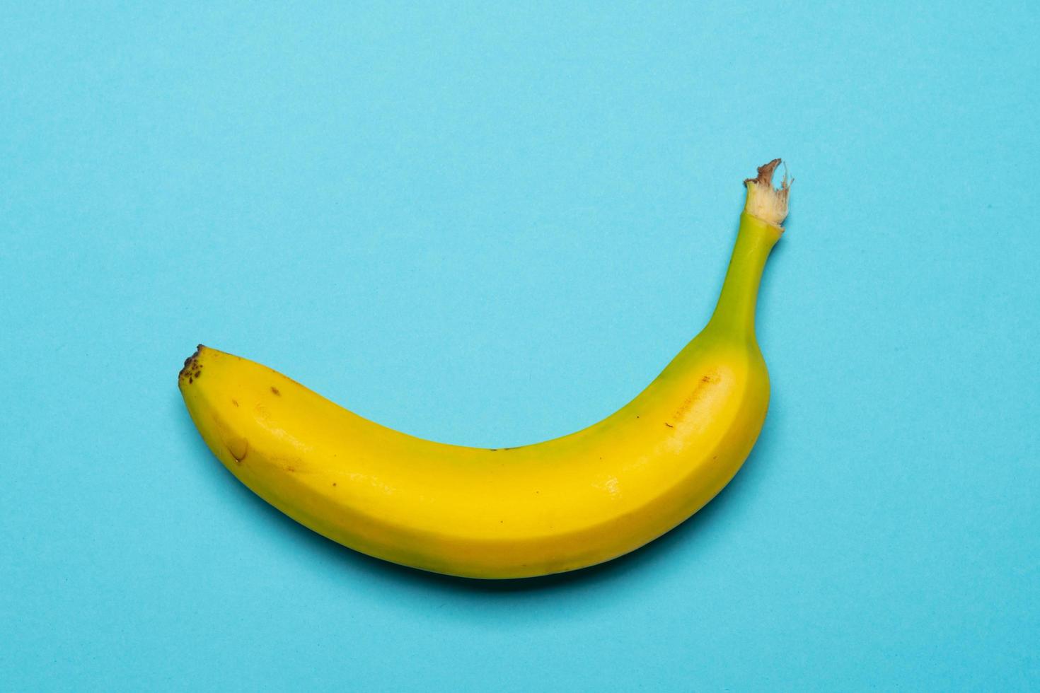 Banana on coloured background still life photo