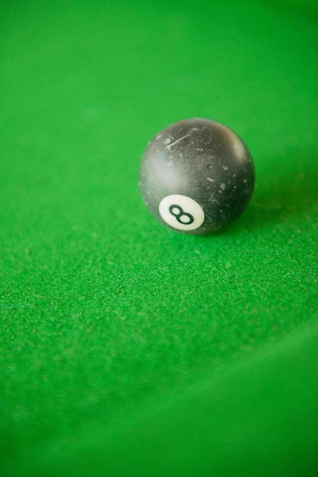 Billard balls on green billard table photo