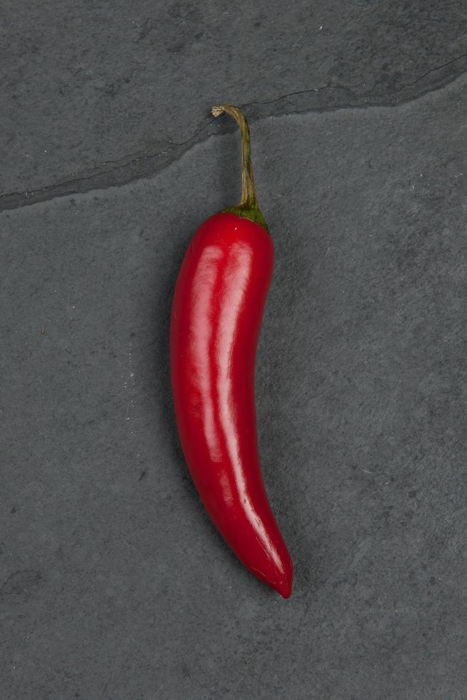 Red pepper on granite table photo