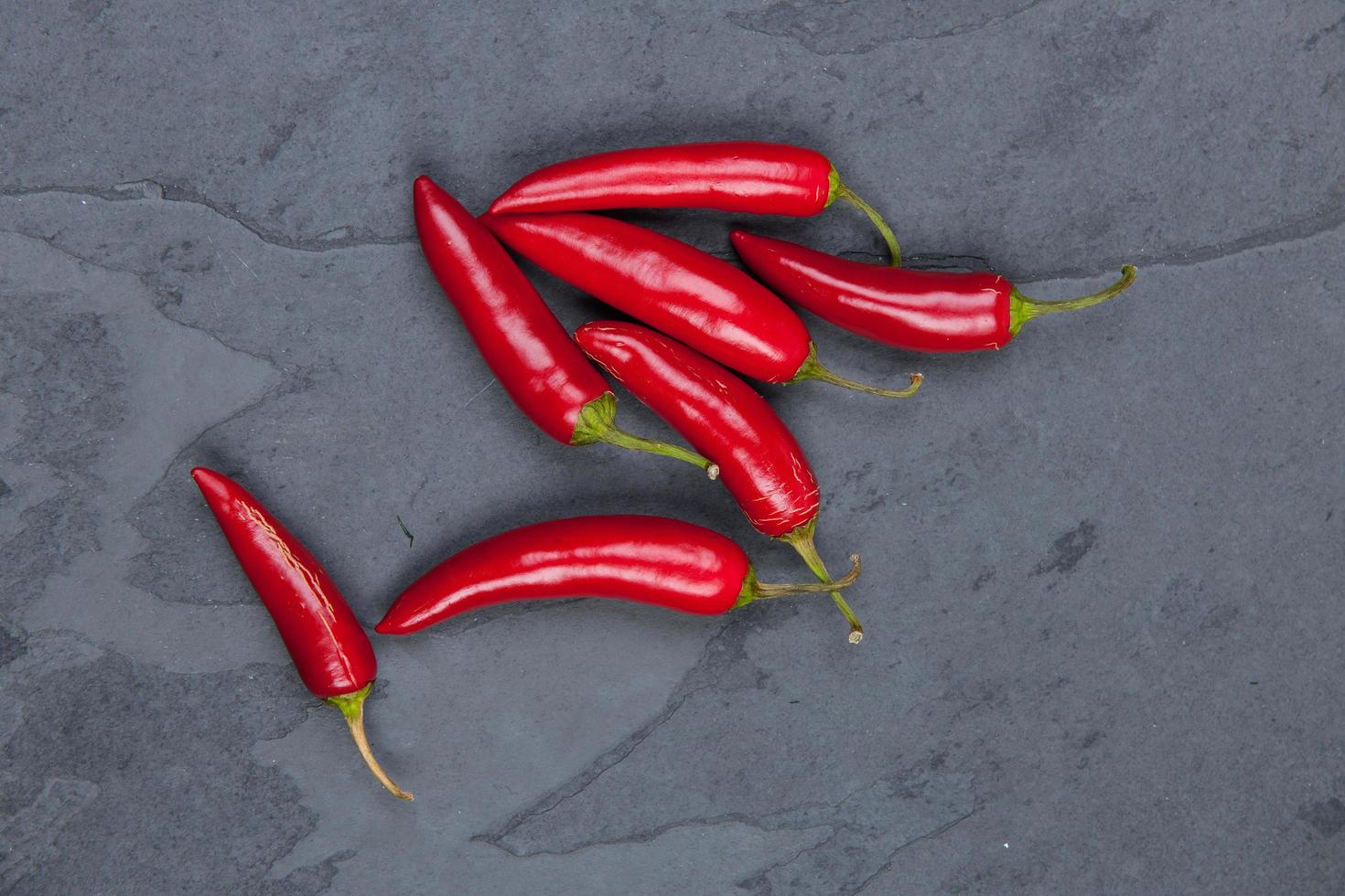 Red peppers on table photo