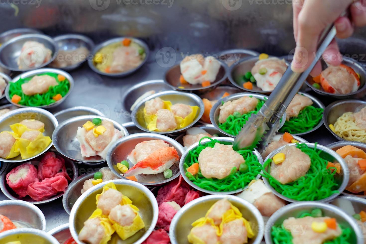 Chinese food dim sum on self service busket tray background. Tradition Dimsum is local food in Songkhla, South of Thailand. photo