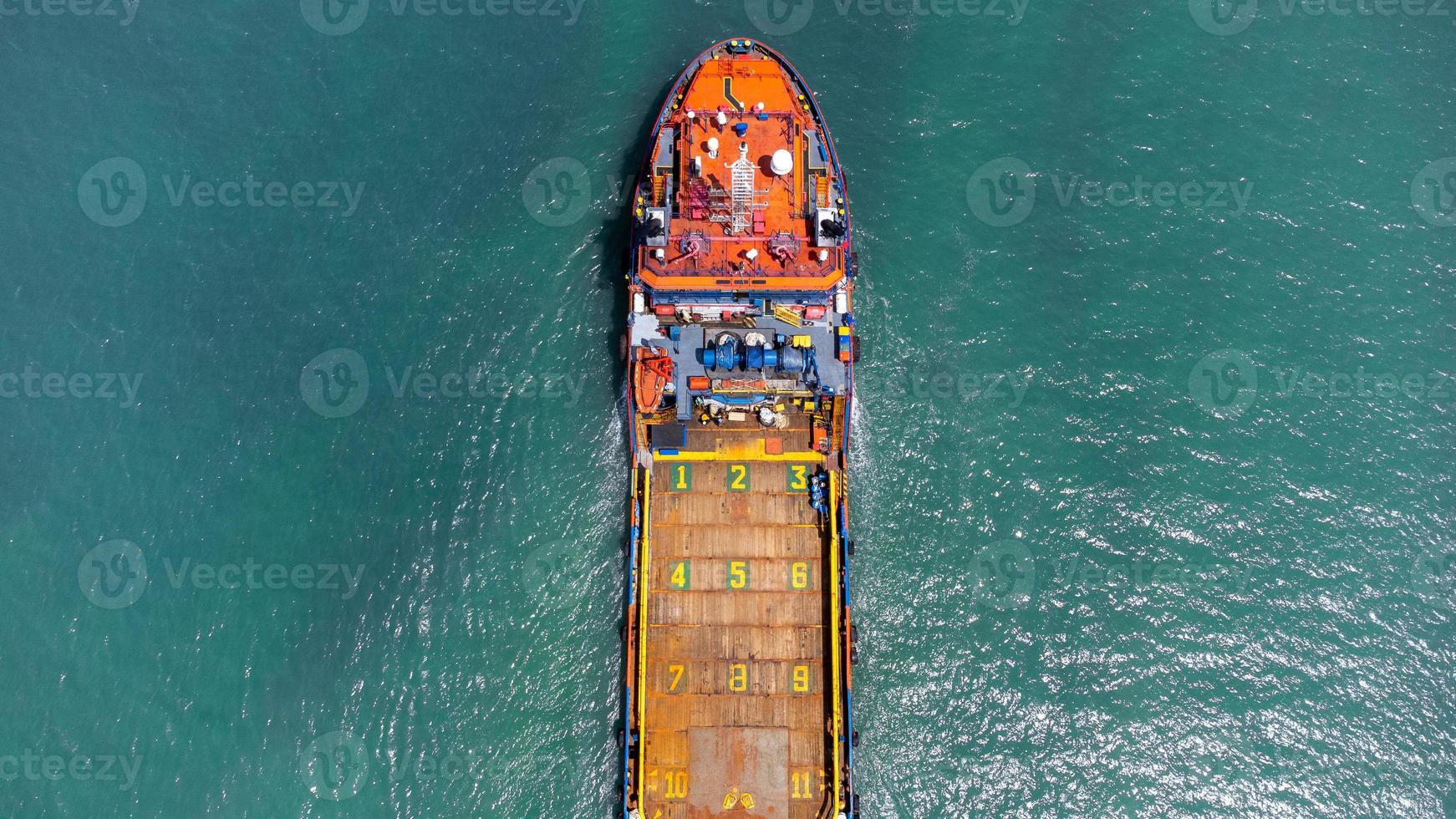 Aerial view on top of cargo ship carrying container and running for export cargo yard port to international custom ocean. Concept of technology transportation , customs clearance, webinar banner. photo