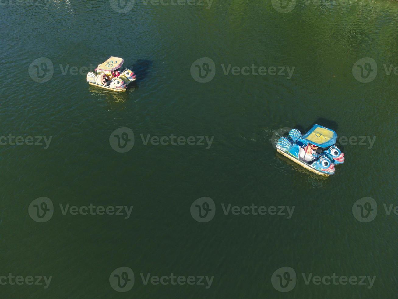 Unidentify tourists enjoying moment  in Hat yai Municipal Park, Songkhla, Thailand with lot activities such as pedal boat and picnic inside park area. photo