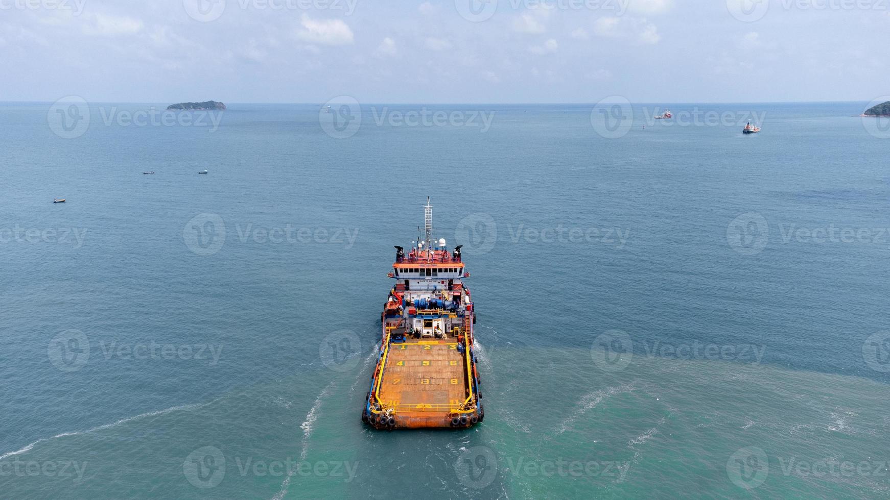 Aerial view on top of cargo ship carrying container and running for export cargo yard port to international custom ocean. Concept of technology transportation , customs clearance, webinar banner. photo