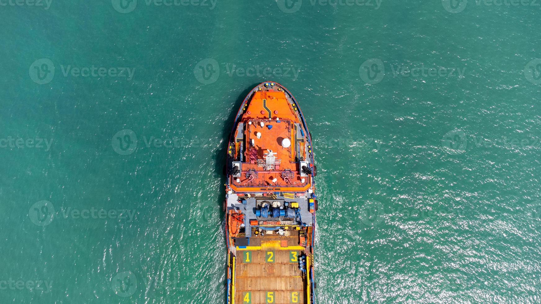 Aerial view on top of cargo ship carrying container and running for export cargo yard port to international custom ocean. Concept of technology transportation , customs clearance, webinar banner. photo