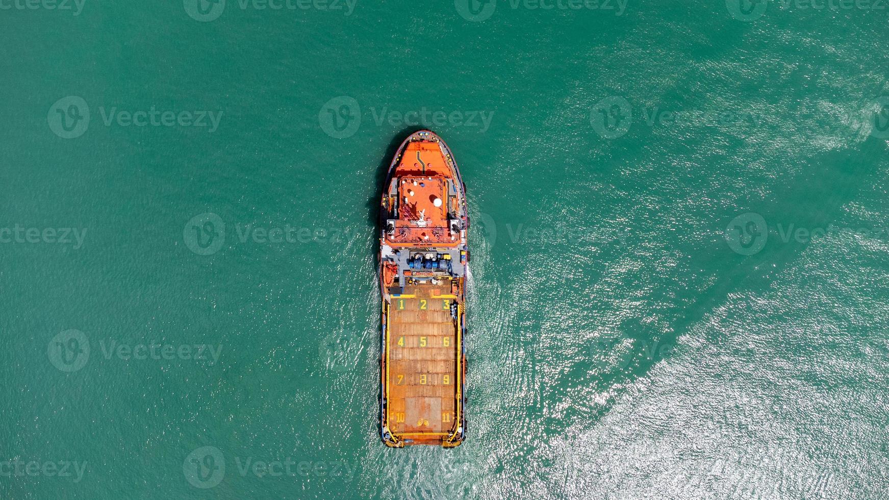 Aerial view on top of cargo ship carrying container and running for export cargo yard port to international custom ocean. Concept of technology transportation , customs clearance, webinar banner. photo