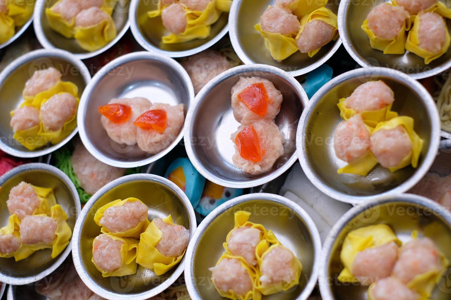 Chinese food dim sum on self service busket tray background. Tradition Dimsum is local food in Songkhla, South of Thailand. photo