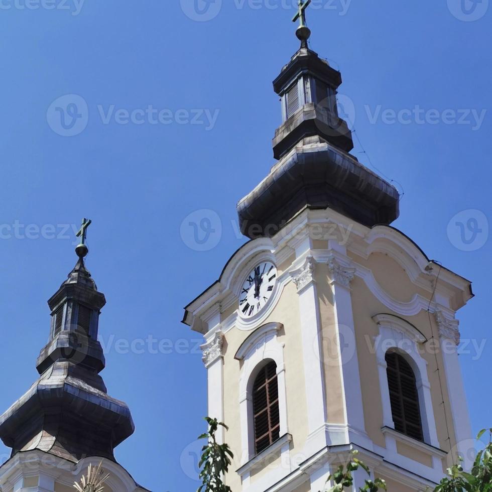 The church in Miskolc is close up with the beautiful large number plate clock photo