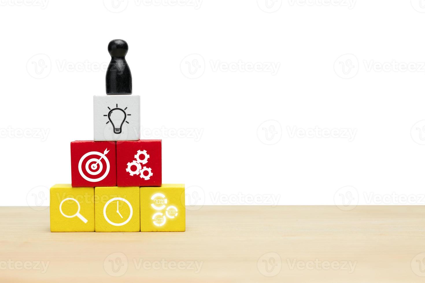 Leadership is essential for teamwork in business.  Icon business on wooden cube photo