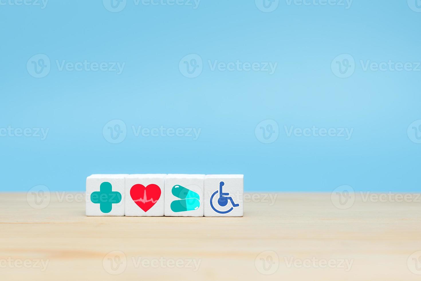 Insurance Concept, Wooden cube with icon healthcare medical. photo