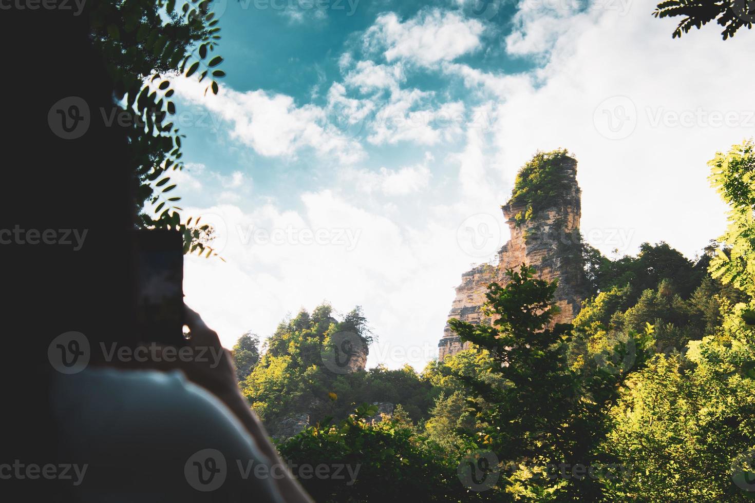 Female person take photo of Sairme pillars in summer with sky background. Hidden gem in Georgia