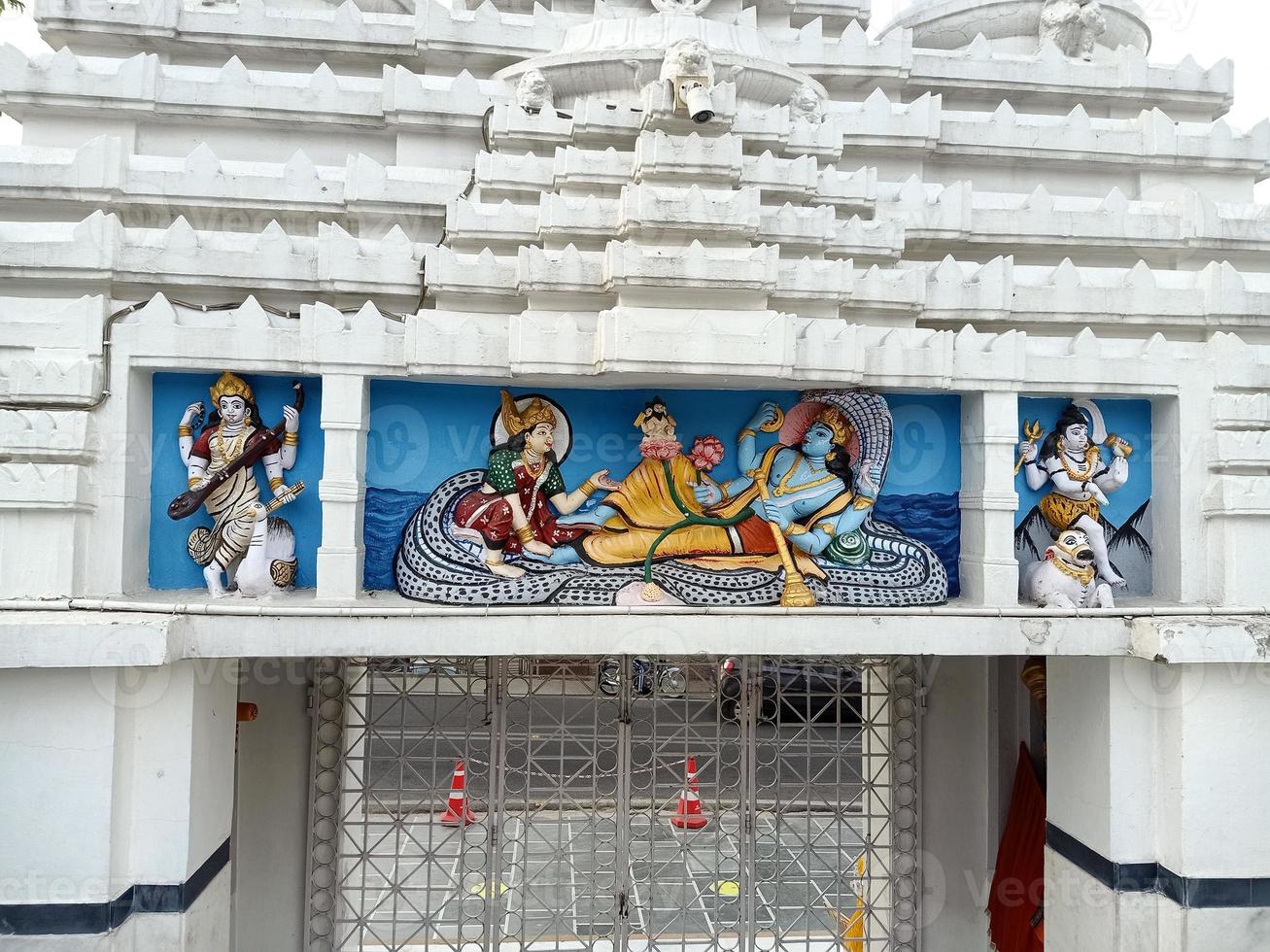 laxmi vishnu and brahma in temple photo