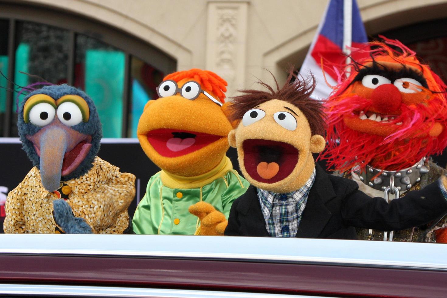 LOS ANGELES, MAR 11 - Sam the Eagle, Fozzie, Walter, Animal at the Muppets Most Wanted , Los Angeles Premiere at the El Capitan Theater on March 11, 2014 in Los Angeles, CA photo