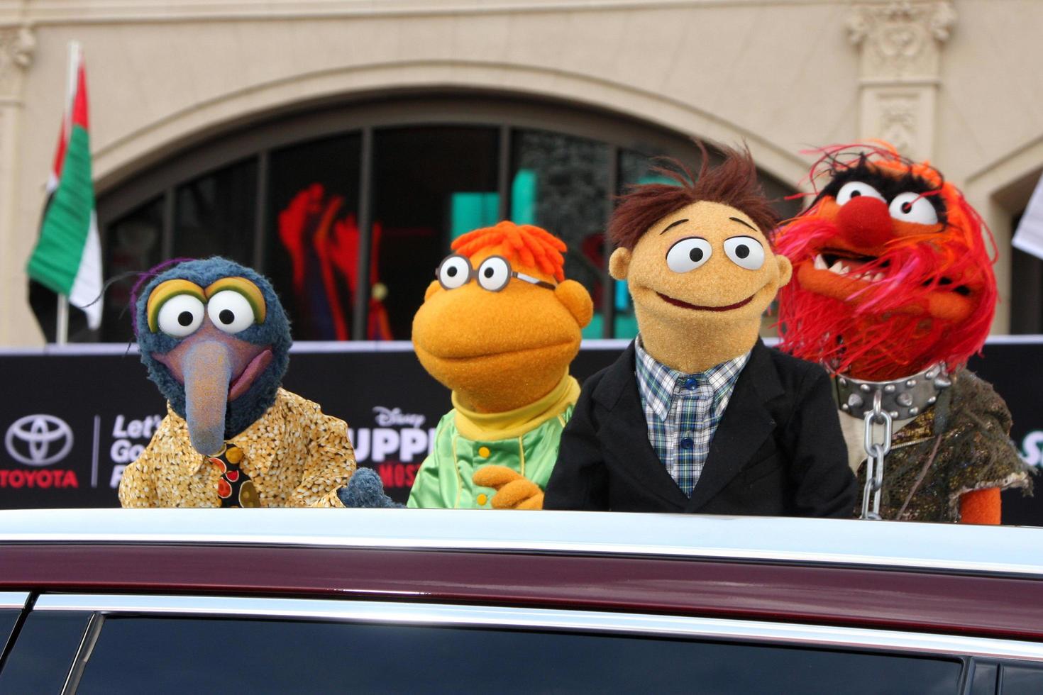 LOS ANGELES, MAR 11 - Sam the Eagle, Fozzie, Walter, Animal at the Muppets Most Wanted , Los Angeles Premiere at the El Capitan Theater on March 11, 2014 in Los Angeles, CA photo