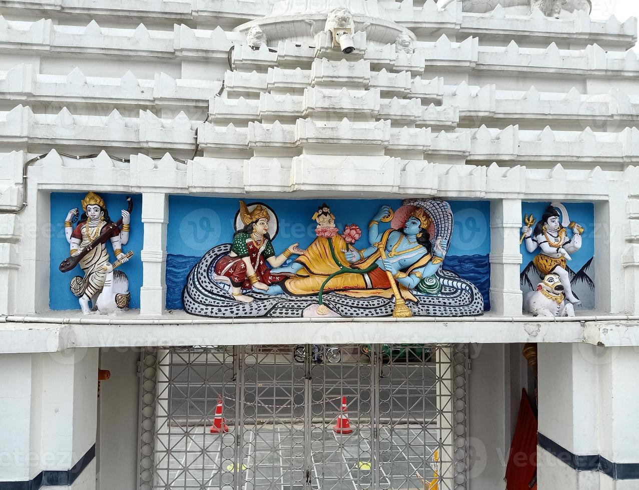 laxmi vishnu and brahma in temple photo