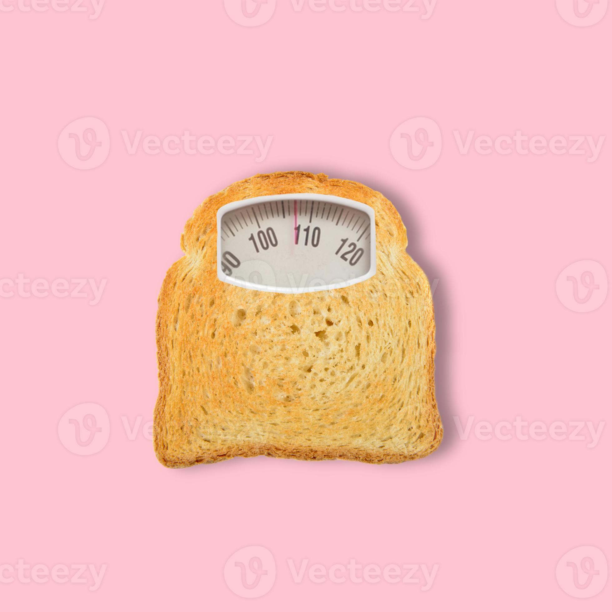 Sliced Toast Bread as an weight scale on pink background. Diet concept. Top  view. Minimal food concept. Collage made out of toast slice and weight scale.  Contemporary art collage. 9772086 Stock Photo