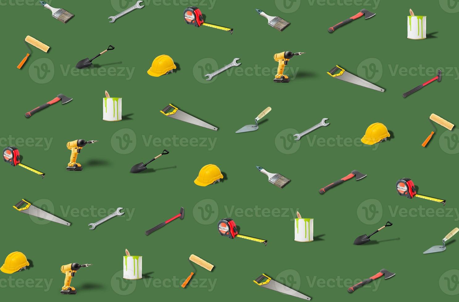 Trends construction tools pattern made with various work tools on green background. Isometric tools and objects. They are representing the concept of DIY. Set of various construction tools photo