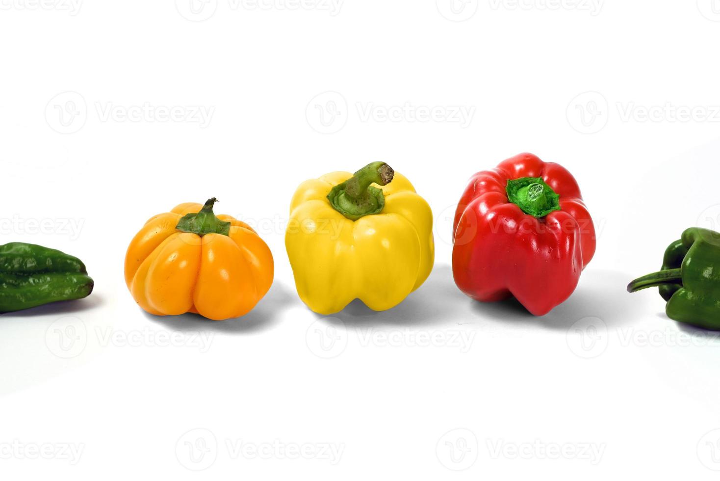 yellow and red peppers white background photo
