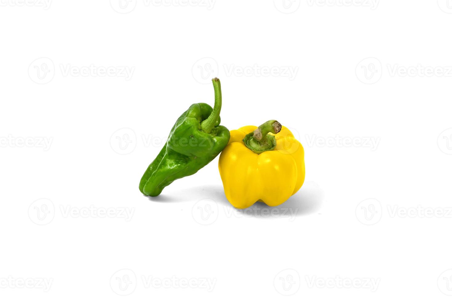 yellow and green peppers white background photo