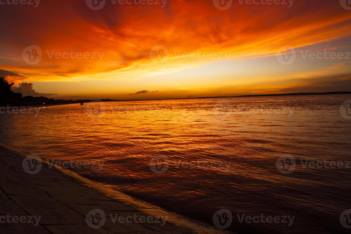 Beautiful  Scenic View Of Sea Against Orange Sky photo