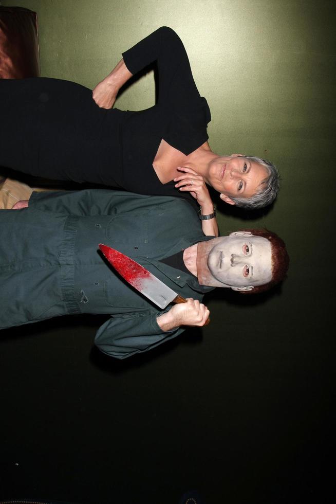 LOS ANGELES, OCT 30 - Jamie Lee Curtis and Michael Myers Costumed Guest at the sCare Foundation Halloween Launch Benefit at Conga Room, LA Live on October 30, 2011 in Los Angeles, CA photo
