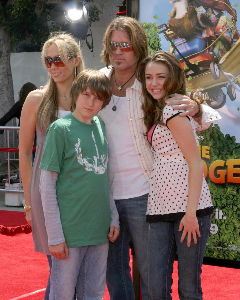 LOS ANGELES, APR 30 - Billy Ray Cyrus and daughter Miley Cyrus arrive at the Over the Hedge LA Premiere at Mann s Village Theater on April 30, 2006 in Westwood, CA photo