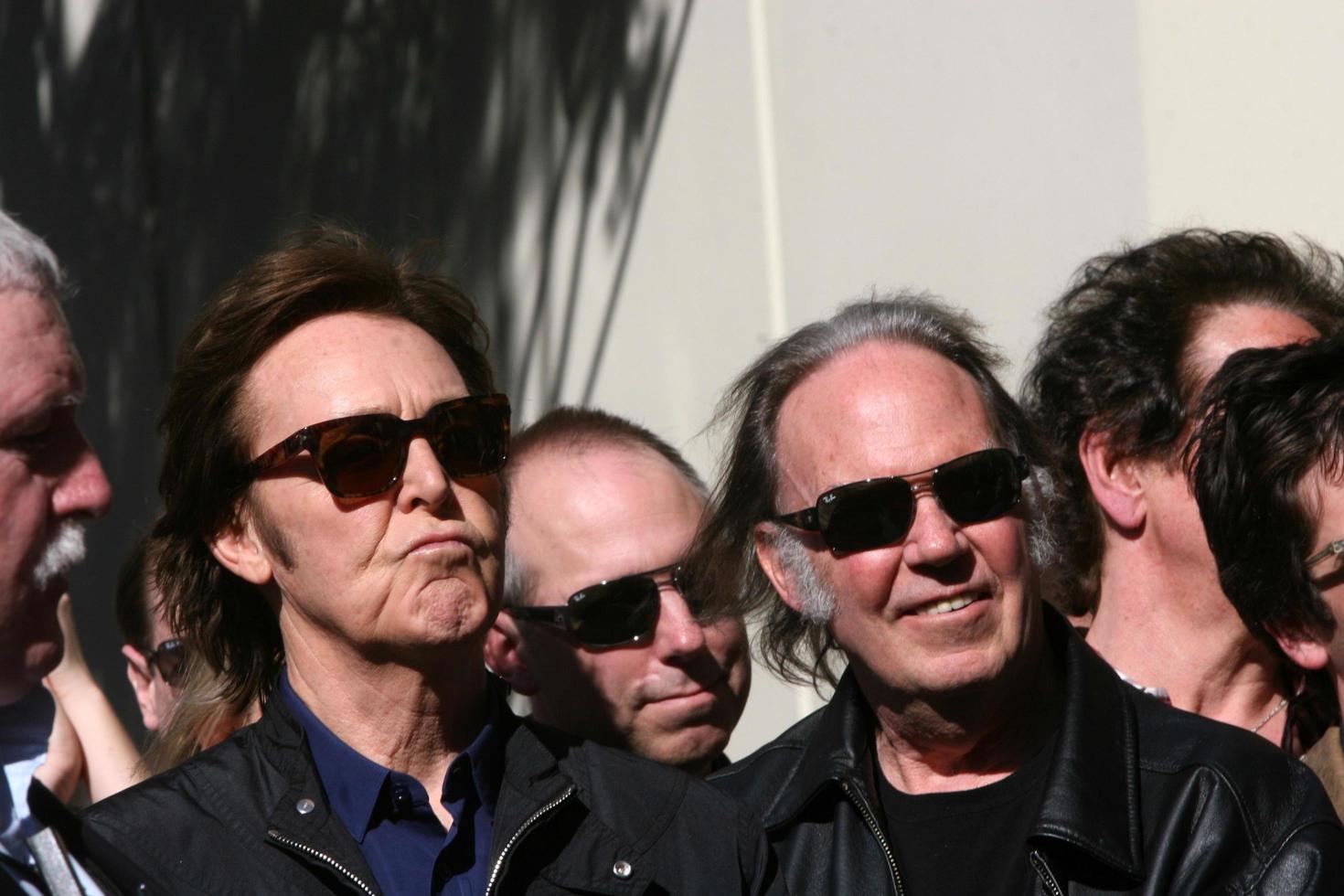 LOS ANGELES, FEB 9 - Paul McCartney, Neil Young at the Hollywood Walk of Fame Ceremony for Paul McCartney at Capital Records Building on February 9, 2012 in Los Angeles, CA photo