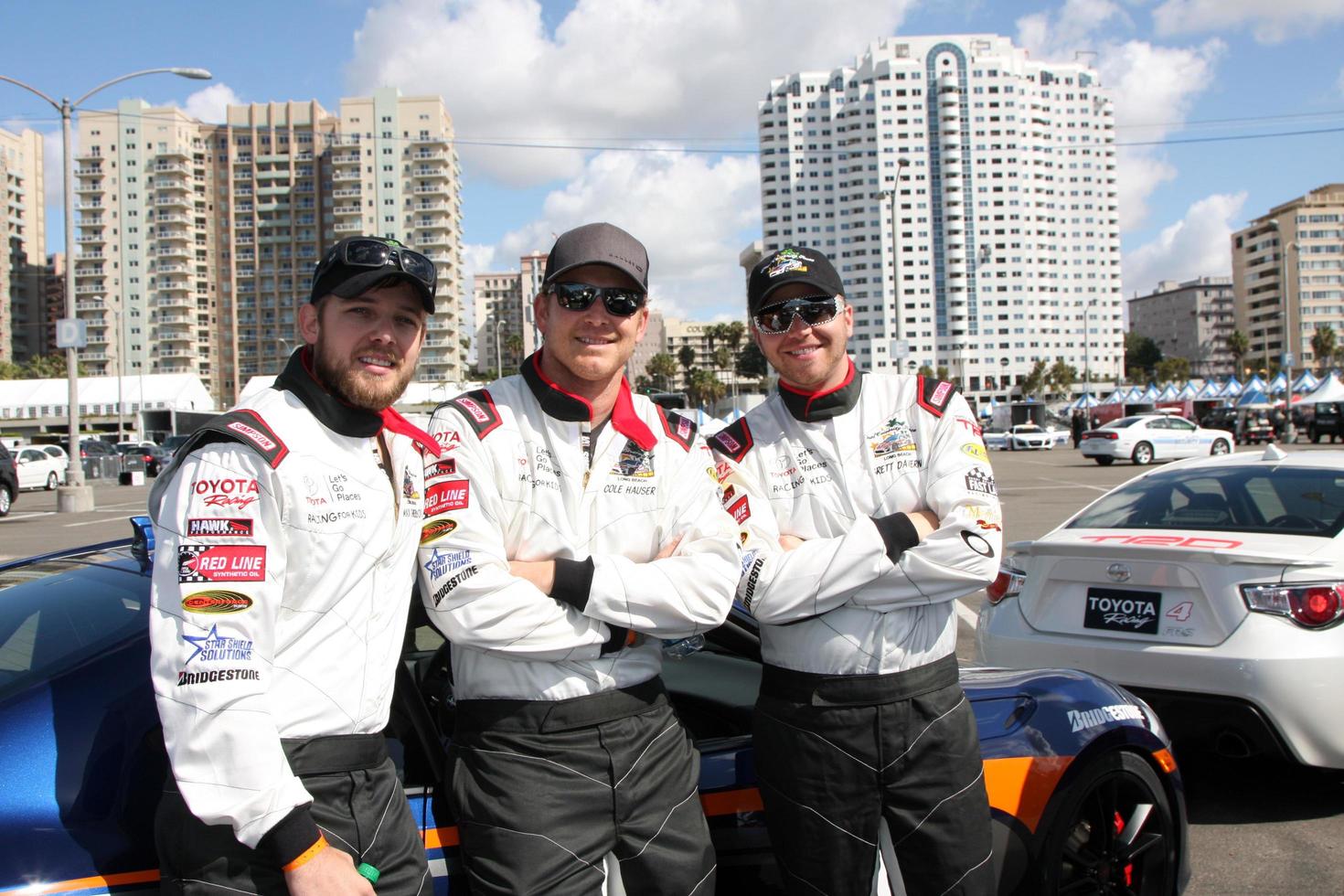 LOS ANGELES, APR 1 - Max Thieriot, Cole Hauser, Brett Davern at the Toyota Grand Prix of Long Beach Pro Celebrity Race Press Day at Long Beach Grand Prix Raceway on April 1, 2014 in Long Beach, CA photo