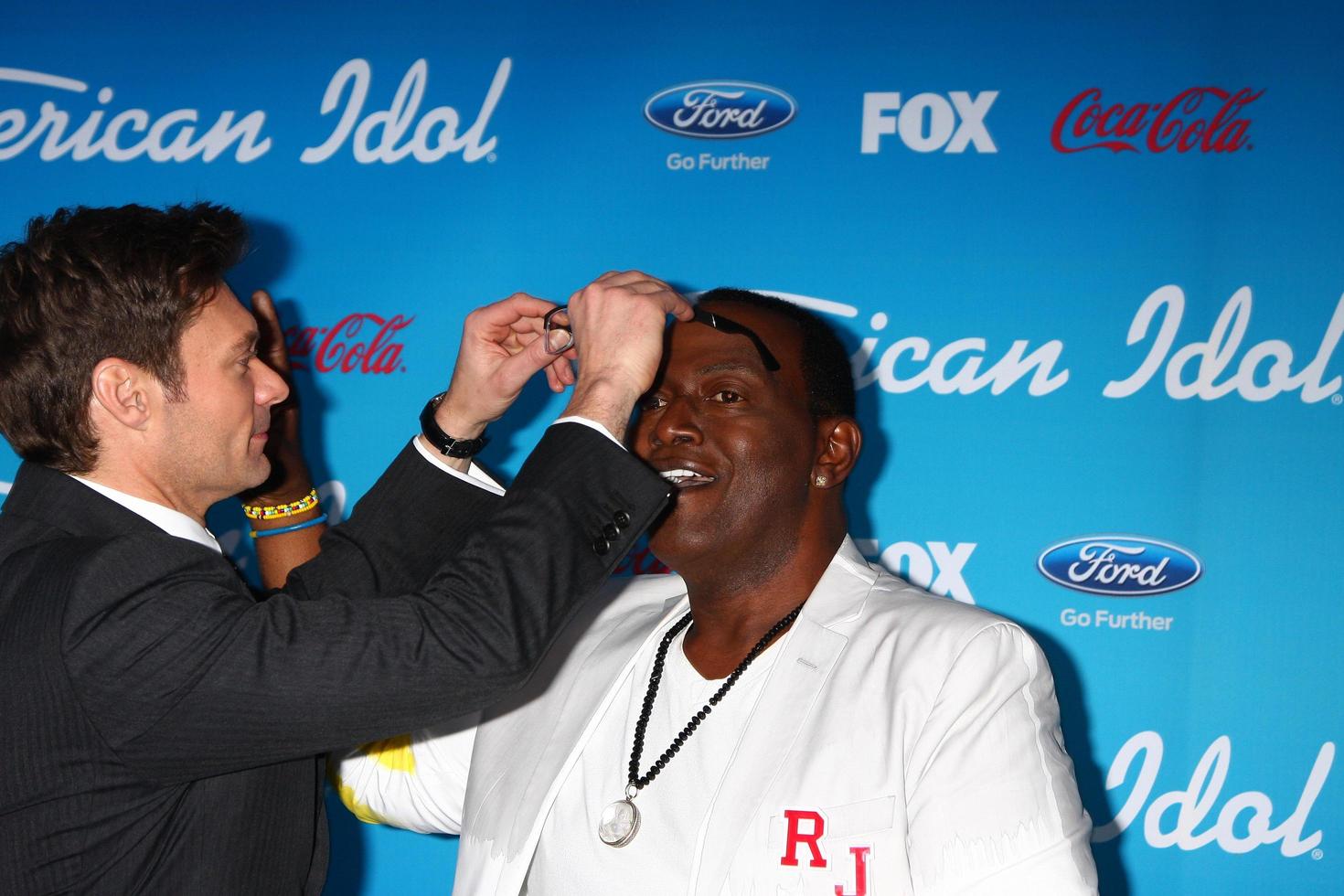 LOS ANGELES, MAR 7 - Ryan Seacrest, Randy Jackson arrives at the 2013 American Idol Finalists Party at the The Grove on March 7, 2013 in Los Angeles, CA photo