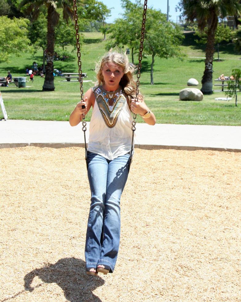 LOS ANGELES, AUG 1 - Savannah Outen playing in the park, wearing Wallflower jeans at Midtown LA on August 1, 2011 in Los Angeles, CA photo