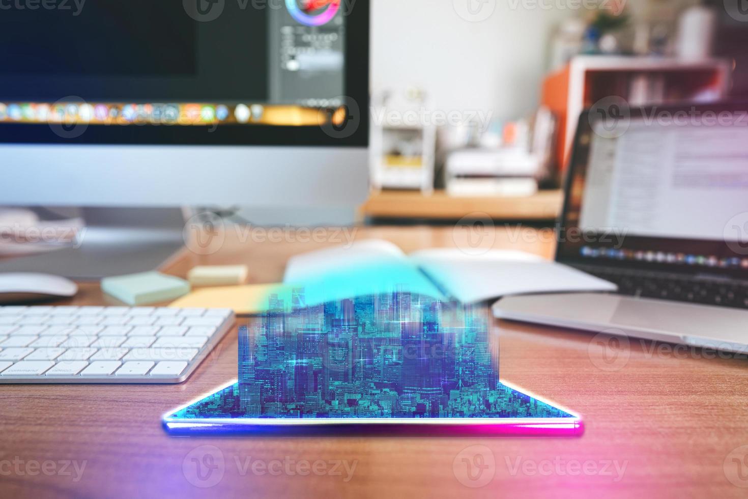 Workplace desk with digital visual hologram neon city and home office background photo