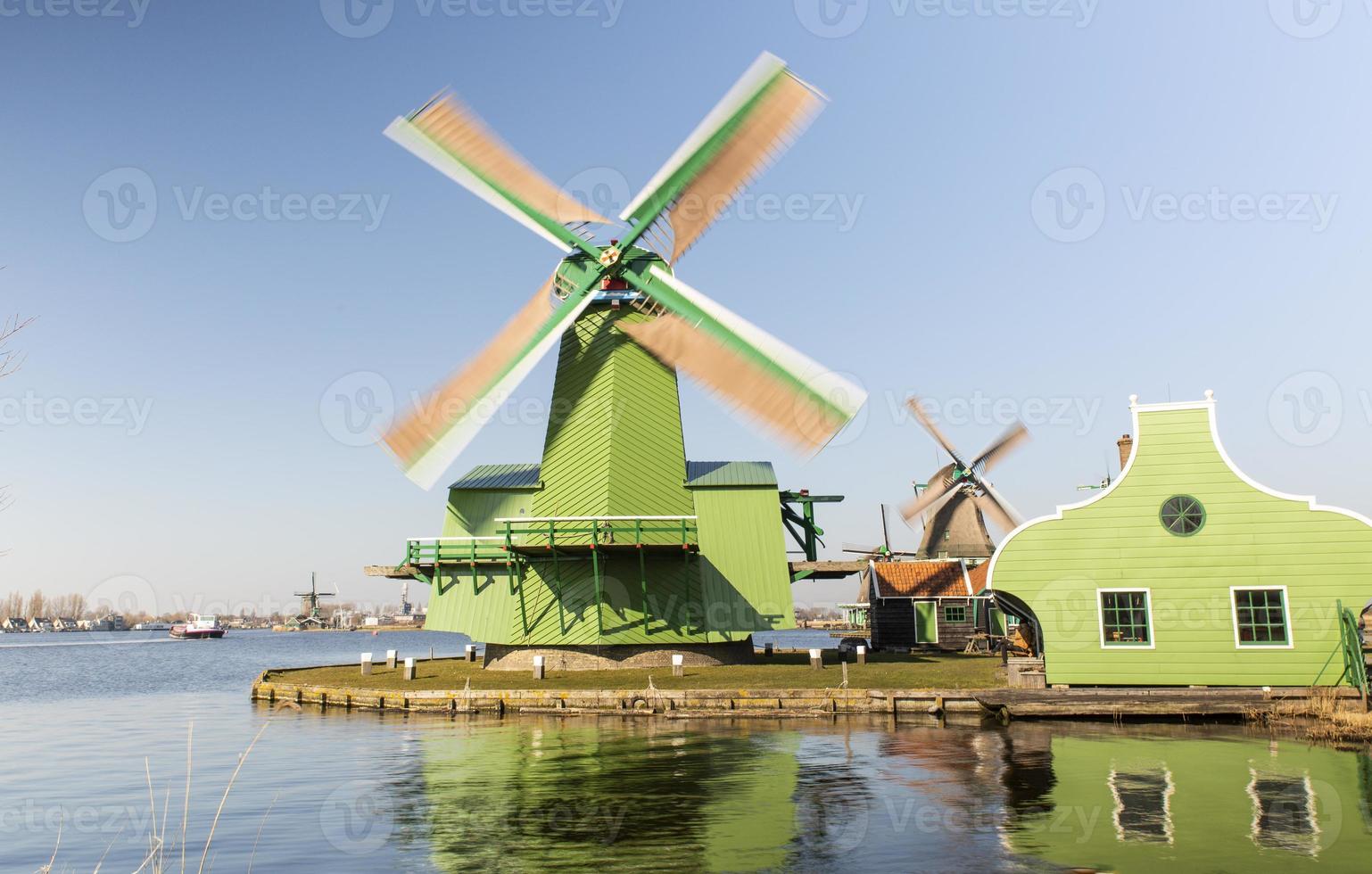 old Dutch mills in motion located in the city of Amsterdam photo