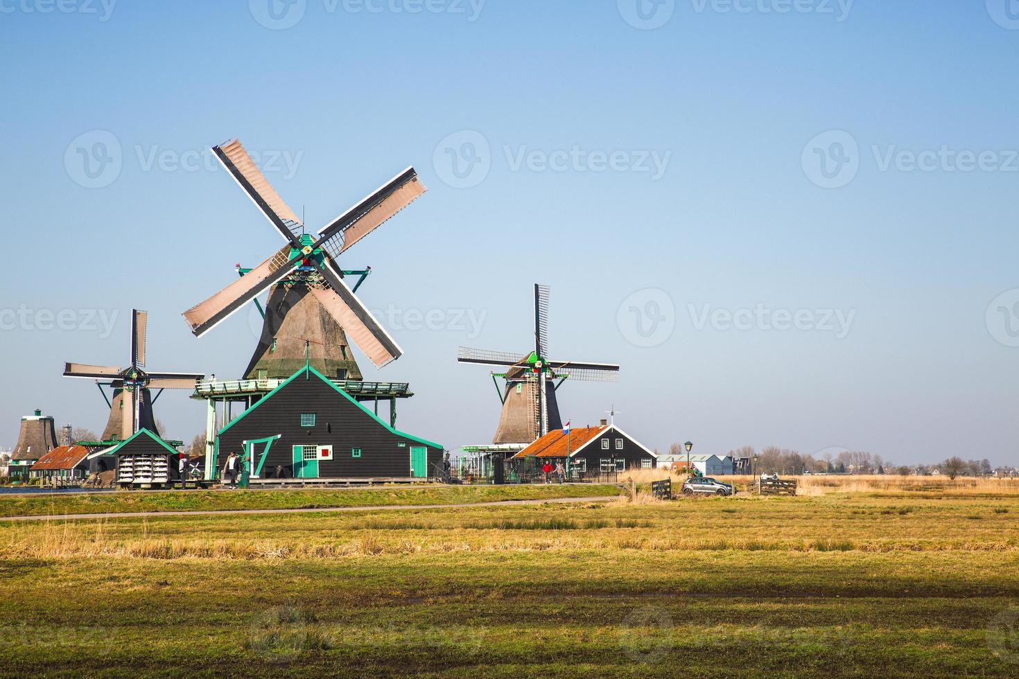old Dutch mills in motion located in the city of Amsterdam photo