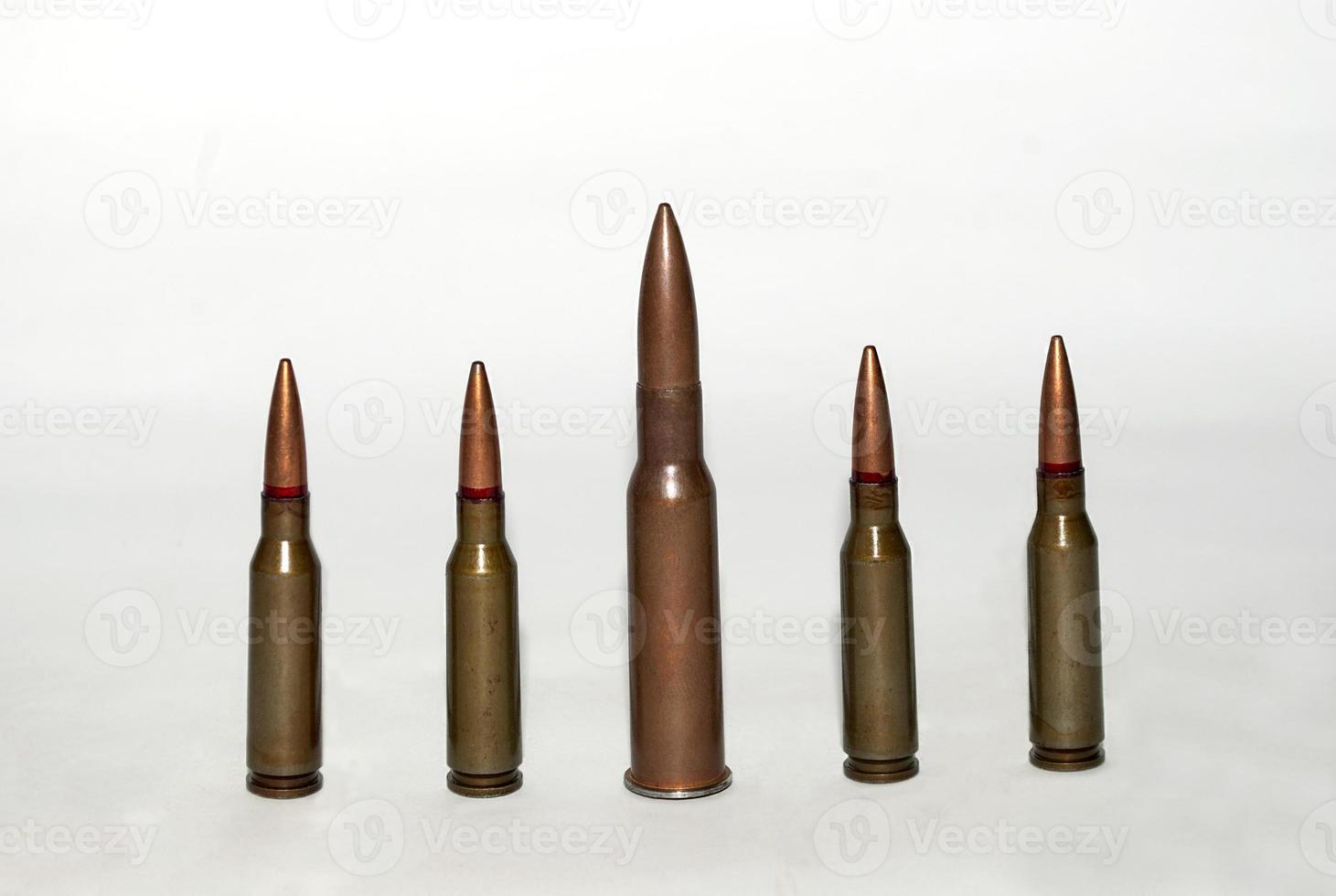 five machine gun cartridges photo