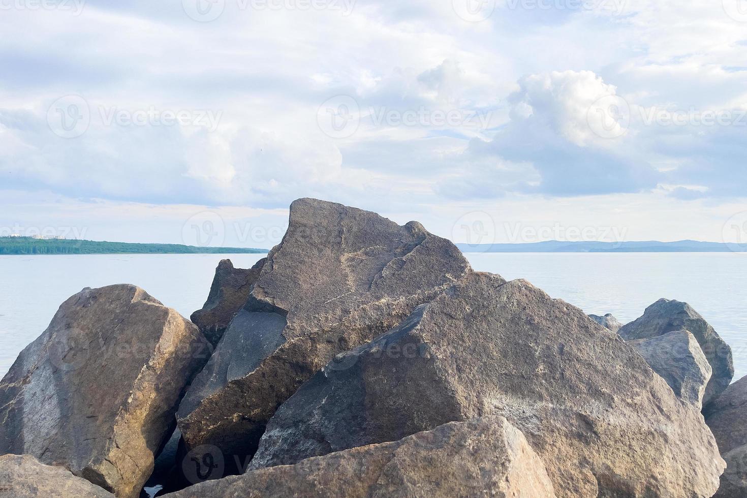 natural huge stones on the seashore photo