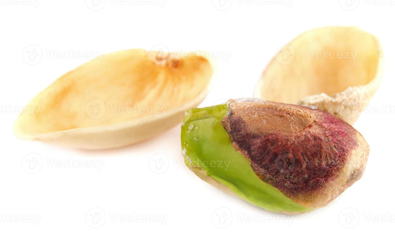 The core of pistachio and shell are isolated on a white background. photo