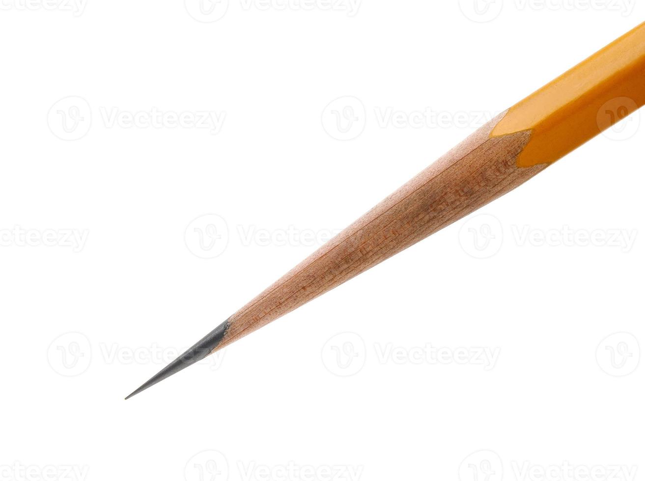 an acutely honed pencil on a white background. photo