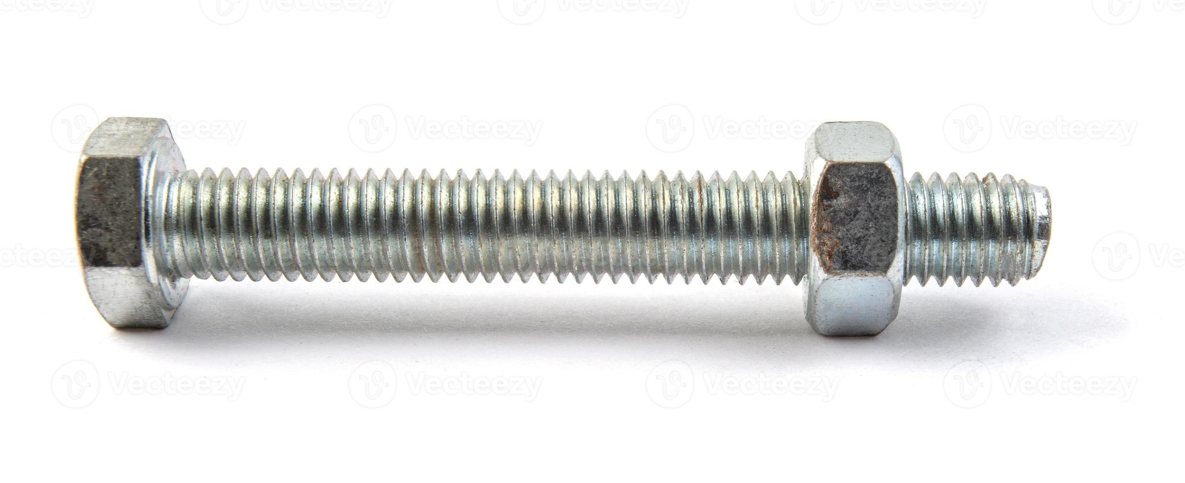 Nut and bolt are insulated on white background. photo