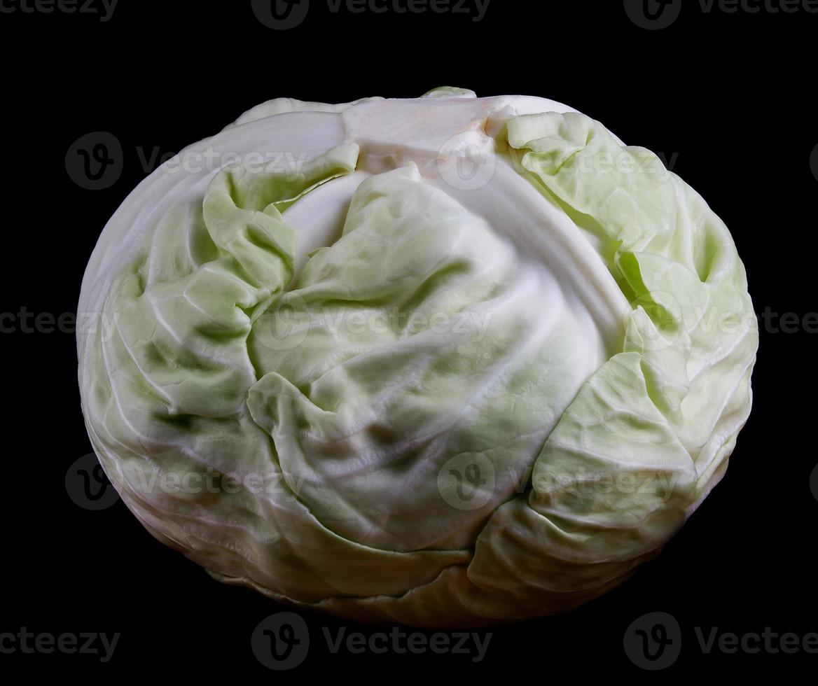 Fresh cabbage, isolated on a black background. photo