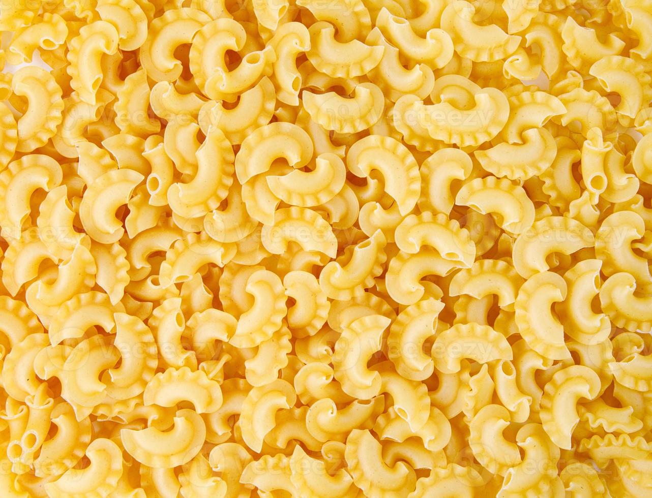 Pasta background. The pasta is filled with an even layer. photo