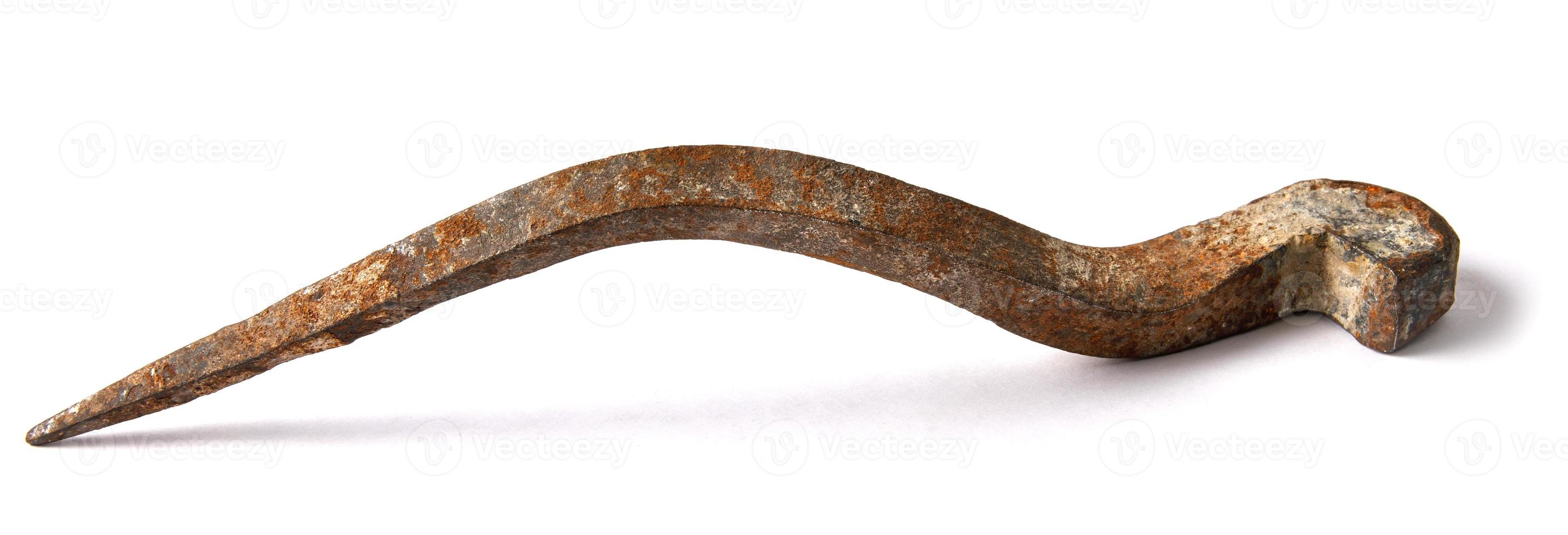 The thick forged nail is isolated on a white background. photo