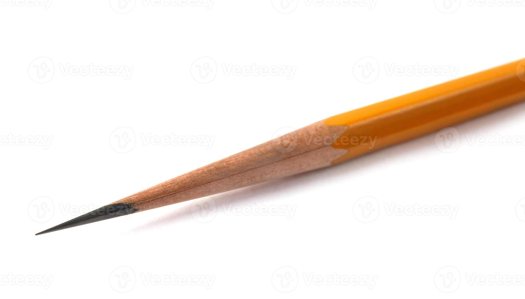 an acutely honed pencil on a white background. photo