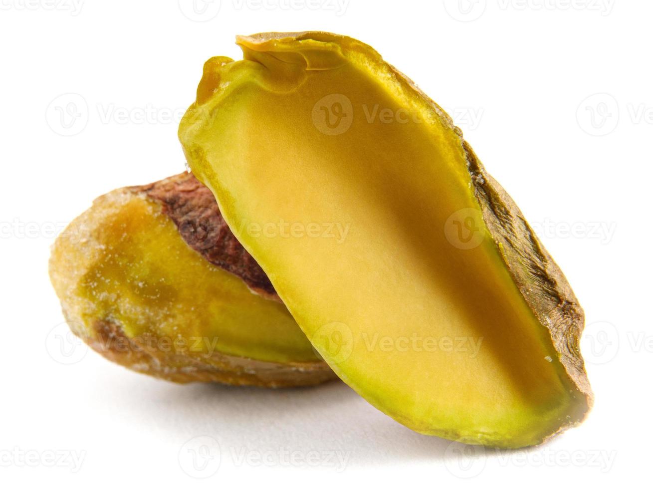 The pistachio core and half are isolated on a white background. photo