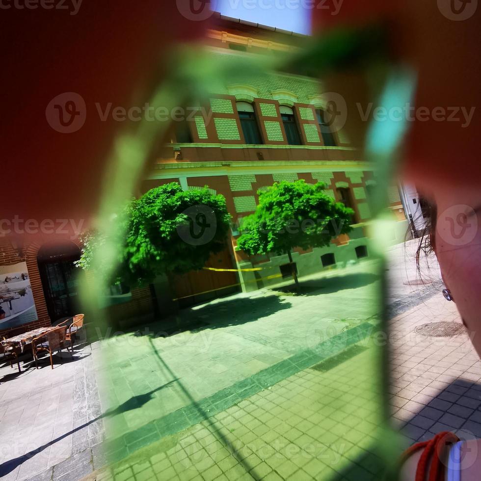 Special image of downtown Miskolc from a piece of green glass photo