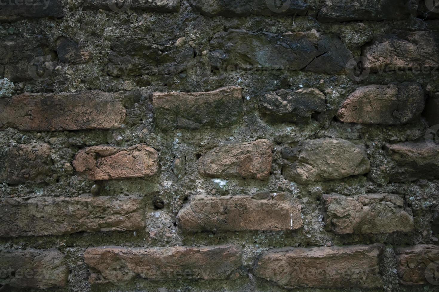vista detallada de primer plano de las antiguas paredes de ladrillo en la textura de fondo de los edificios históricos foto