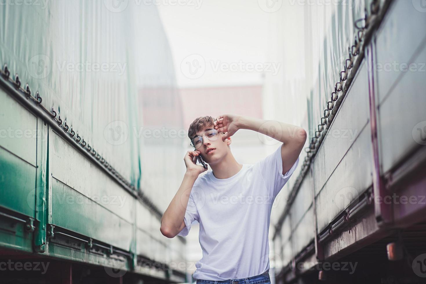 man in t-shirt with a smartphone photo